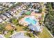 Community aerial view featuring a pool, playground, sport court, and well-maintained landscaping at 9140 Hillcroft Dr, Riverview, FL 33578