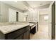 Bathroom featuring double granite vanity, and tile floors and doorway to bedroom at 9140 Hillcroft Dr, Riverview, FL 33578