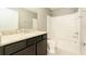 Bathroom with single vanity, granite countertop, and shower-tub combination at 9140 Hillcroft Dr, Riverview, FL 33578