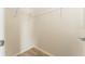 Walk-in closet features wire shelving and wood look flooring at 9140 Hillcroft Dr, Riverview, FL 33578