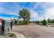 View of the gated entrance with tropical landscaping, mailbox cluster, and access control at 9140 Hillcroft Dr, Riverview, FL 33578