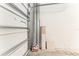 Garage interior showing white door, painted block wall, and concrete floor at 9140 Hillcroft Dr, Riverview, FL 33578