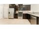 Sleek kitchen features stainless steel appliances, granite countertops, and ample cabinet space for storage at 9140 Hillcroft Dr, Riverview, FL 33578