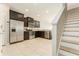 Modern kitchen with stainless steel appliances, granite countertops, and dark cabinets, offering style and functionality at 9140 Hillcroft Dr, Riverview, FL 33578