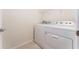 Laundry room with white washer and dryer at 9140 Hillcroft Dr, Riverview, FL 33578