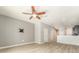 Bright living room features modern flooring, ceiling fan, and neutral walls at 9140 Hillcroft Dr, Riverview, FL 33578