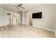 Large main bedroom with ceiling fan, ensuite bath, and walk-in closet at 9140 Hillcroft Dr, Riverview, FL 33578