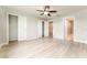 A gray main bedroom featuring a ceiling fan, large closet, and ensuite bathroom at 9140 Hillcroft Dr, Riverview, FL 33578