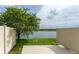 Back patio with fence and serene lake view at 9140 Hillcroft Dr, Riverview, FL 33578
