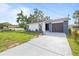 Lovely single-story home boasting manicured landscaping and modern design elements at 9511 N Hyaleah Rd, Tampa, FL 33617