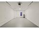 Clean, spacious garage with neutral paint, utility connections, and an access door, ready for use at 9511 N Hyaleah Rd, Tampa, FL 33617