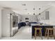 Modern kitchen featuring two-tone cabinetry, stainless steel appliances, and ample counter space at 9511 N Hyaleah Rd, Tampa, FL 33617