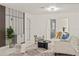 Bright living room featuring stylish decor, modern lighting, and sleek floors, creating an inviting atmosphere at 9511 N Hyaleah Rd, Tampa, FL 33617
