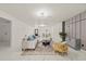 Elegant living room featuring modern décor, marble flooring, and inviting furniture arrangement at 9511 N Hyaleah Rd, Tampa, FL 33617