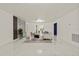 Bright living room with marble floors, modern decor, and an open concept design at 9511 N Hyaleah Rd, Tampa, FL 33617