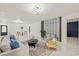 Stylish living room featuring modern décor, marble floors, and an open layout for entertaining at 9511 N Hyaleah Rd, Tampa, FL 33617