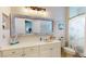 Bathroom with large mirror, decorative accents, and a marine-themed shower curtain with a standard white toilet at 9800 Sago Point Dr, Seminole, FL 33777