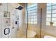 Modern bathroom featuring a walk-in shower and bathtub with luxurious finishes at 9800 Sago Point Dr, Seminole, FL 33777