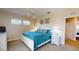 Comfortable bedroom featuring a ceiling fan, serene artwork, and bright natural light from windows at 9800 Sago Point Dr, Seminole, FL 33777