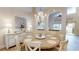 Dining room showcases modern furnishings and fixtures and views into other main level rooms at 9800 Sago Point Dr, Seminole, FL 33777