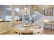Spacious dining room with views of the staircase and living spaces, filled with natural light at 9800 Sago Point Dr, Seminole, FL 33777
