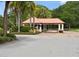 Community entrance and guard house, ensuring secure and private access for residents and visitors alike at 9800 Sago Point Dr, Seminole, FL 33777