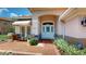 Inviting front entrance with well-maintained landscaping and a cozy front patio, creating great curb appeal at 9800 Sago Point Dr, Seminole, FL 33777
