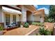 Charming front porch featuring a cozy seating area and well-maintained landscaping, perfect for relaxation at 9800 Sago Point Dr, Seminole, FL 33777