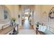 Spacious hallway with stylish decor, connecting to a bright living area and a well-lit dining space at 9800 Sago Point Dr, Seminole, FL 33777