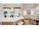 Updated kitchen features white cabinetry, stainless appliances, and an adjacent dining area with chandelier lighting at 9800 Sago Point Dr, Seminole, FL 33777
