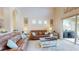 Comfortable living area with hardwood floors and large sliding glass doors, creating a bright atmosphere at 9800 Sago Point Dr, Seminole, FL 33777