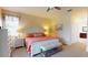 Bright main bedroom with carpeted floors, queen bed, and dresser, offering plenty of closet space at 9800 Sago Point Dr, Seminole, FL 33777