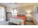 Cozy main bedroom features a queen-sized bed, dresser, and bench with a lovely view at 9800 Sago Point Dr, Seminole, FL 33777