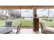 Inviting screened patio offers serene water views and outdoor living space at 9800 Sago Point Dr, Seminole, FL 33777