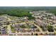 Aerial view of a property in a residential neighborhood, showcasing nearby trees and community at 10228 Yellow Pine Way, Hudson, FL 34667
