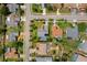 Overhead shot showcases a home in a residential neighborhood with lush landscaping at 10228 Yellow Pine Way, Hudson, FL 34667