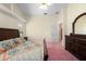 Bedroom featuring a king size bed, ceiling fan, and dresser at 10228 Yellow Pine Way, Hudson, FL 34667