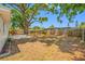 Large backyard with mature tree, wood fence, and patio area perfect for outdoor activities and entertaining at 10599 111Th N Ave, Largo, FL 33773