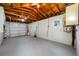 Spacious basement with painted floor and exposed wood rafters at 10599 111Th N Ave, Largo, FL 33773