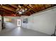 Spacious basement with painted floor and exposed wood rafters at 10599 111Th N Ave, Largo, FL 33773