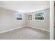 Bright bedroom with tile flooring and natural light from two windows at 10599 111Th N Ave, Largo, FL 33773