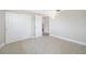 Bedroom featuring tile flooring, closet, and views to the bathroom at 10599 111Th N Ave, Largo, FL 33773