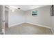 Bedroom with tile floor, window, baseboards, and neutral paint at 10599 111Th N Ave, Largo, FL 33773