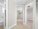 Hallway showcasing tile flooring and views into other rooms at 10599 111Th N Ave, Largo, FL 33773