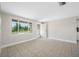 Bright living area features tile flooring, neutral walls, and large windows offering natural light and a welcoming atmosphere at 10599 111Th N Ave, Largo, FL 33773