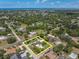 Aerial view with property lines, showing the house, pool, backyard, and proximity to the waterfront at 10611 131St St, Largo, FL 33774