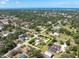 Stunning aerial view of property showcasing pool, landscaping, and proximity to the ocean at 10611 131St St, Largo, FL 33774