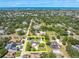 Aerial view with property lines showing the well-maintained home, pool, and expansive yard, near the ocean at 10611 131St St, Largo, FL 33774