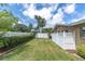 Fenced backyard area with a well-kept lawn, providing a private and secure outdoor space at 10611 131St St, Largo, FL 33774