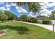 Manicured lawn and landscaping surrounds this well kept single Gathering home at 10611 131St St, Largo, FL 33774